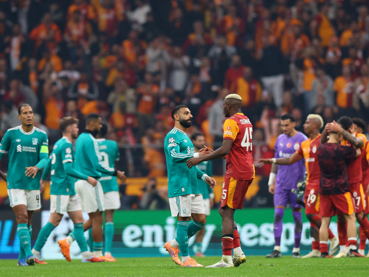 Liverpool's Mohamed Salah is gracious in defeat with Galatasaray's Victor Osimhen. Photo: Reuters