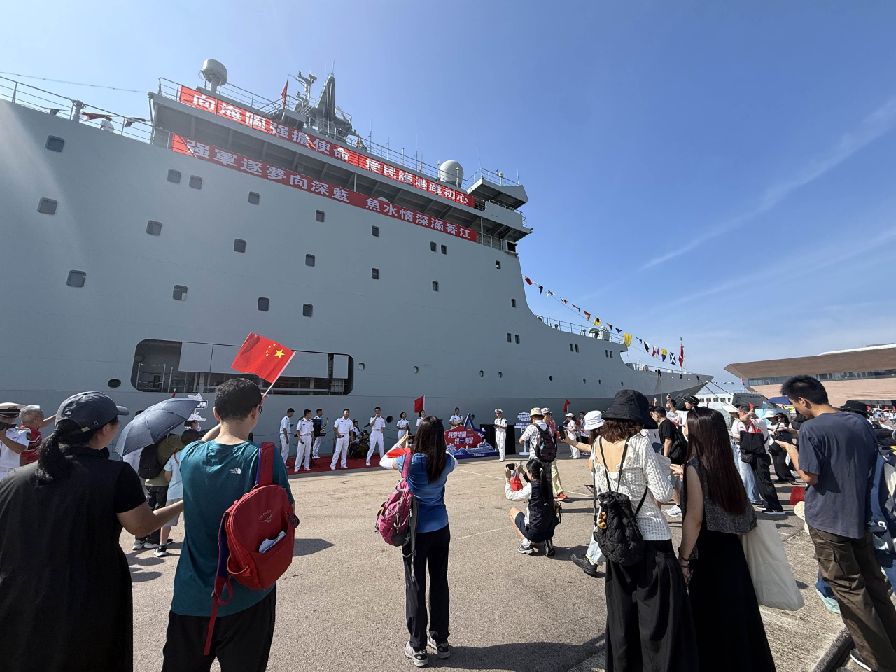 PLA navy personnel strike up a festive atmosphere for visitors with a musical performance in the shade of Qi Jiguang. Photo: RTHK