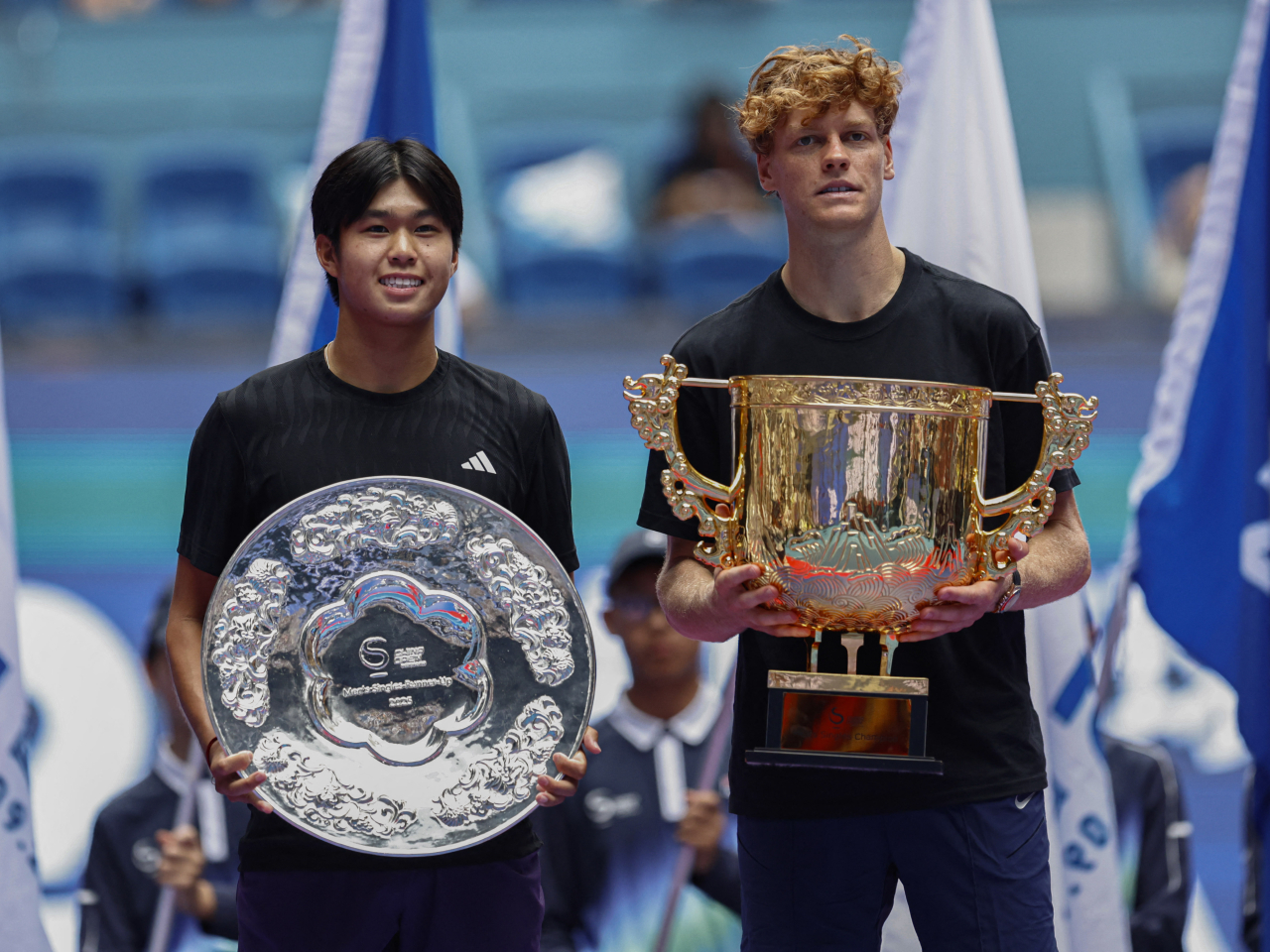 Jannik Sinner, right, outclasses 19-year-old Learner Tien, who was in his first ATP final. Photo: Reuters