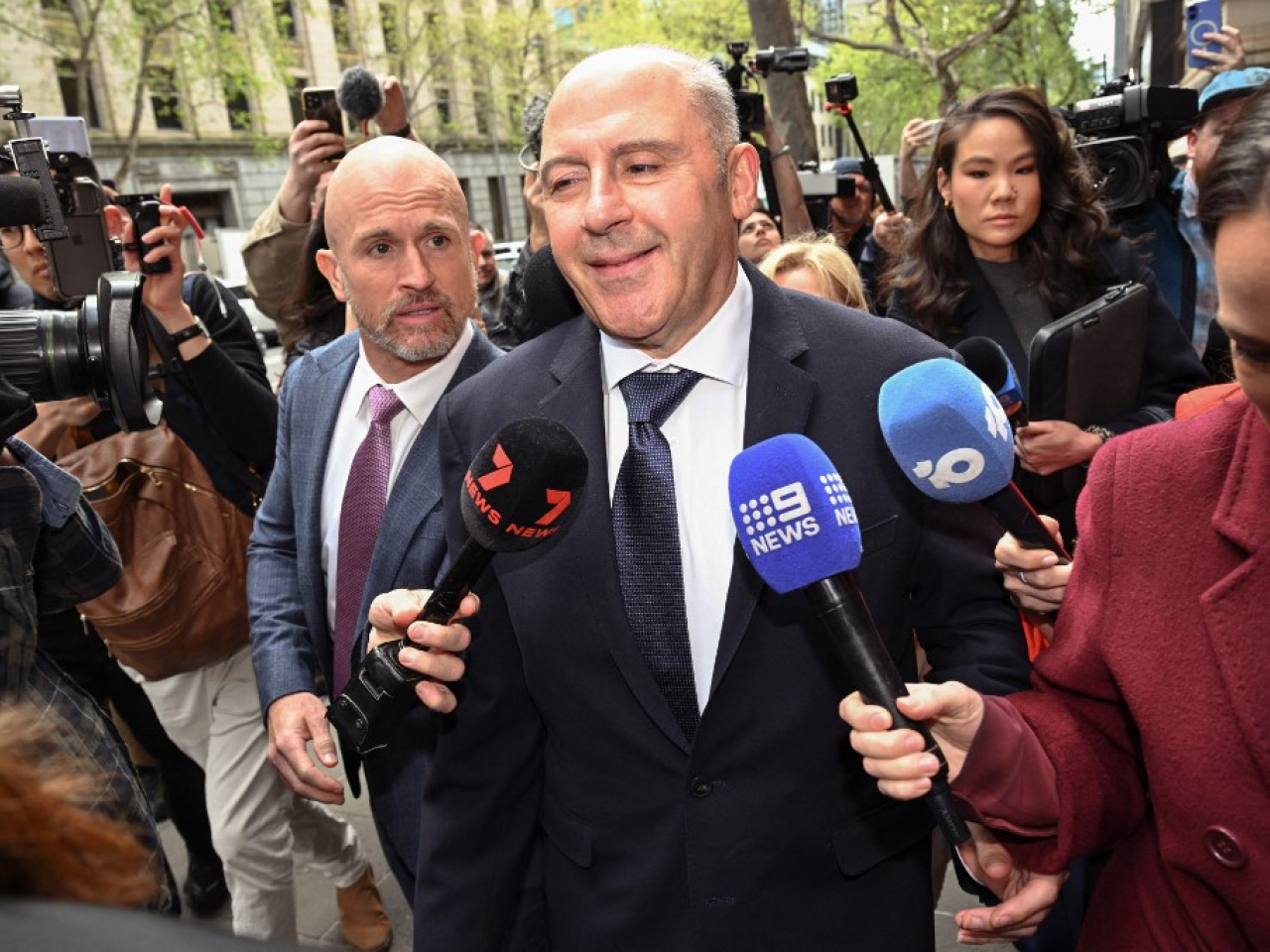 Tony Mokbel is inundated by reporters after the Victorian Court of Appeal in Melbourne ruled in favour of a retrial. Photo: AFP