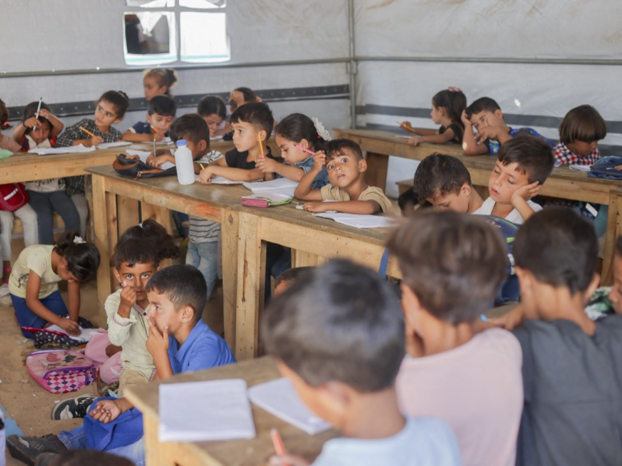 Palestinian children pack a tent classroom in Al-Mawasi, which the UN calls 'one of the most densely populated places on Earth'. File photo: AFP