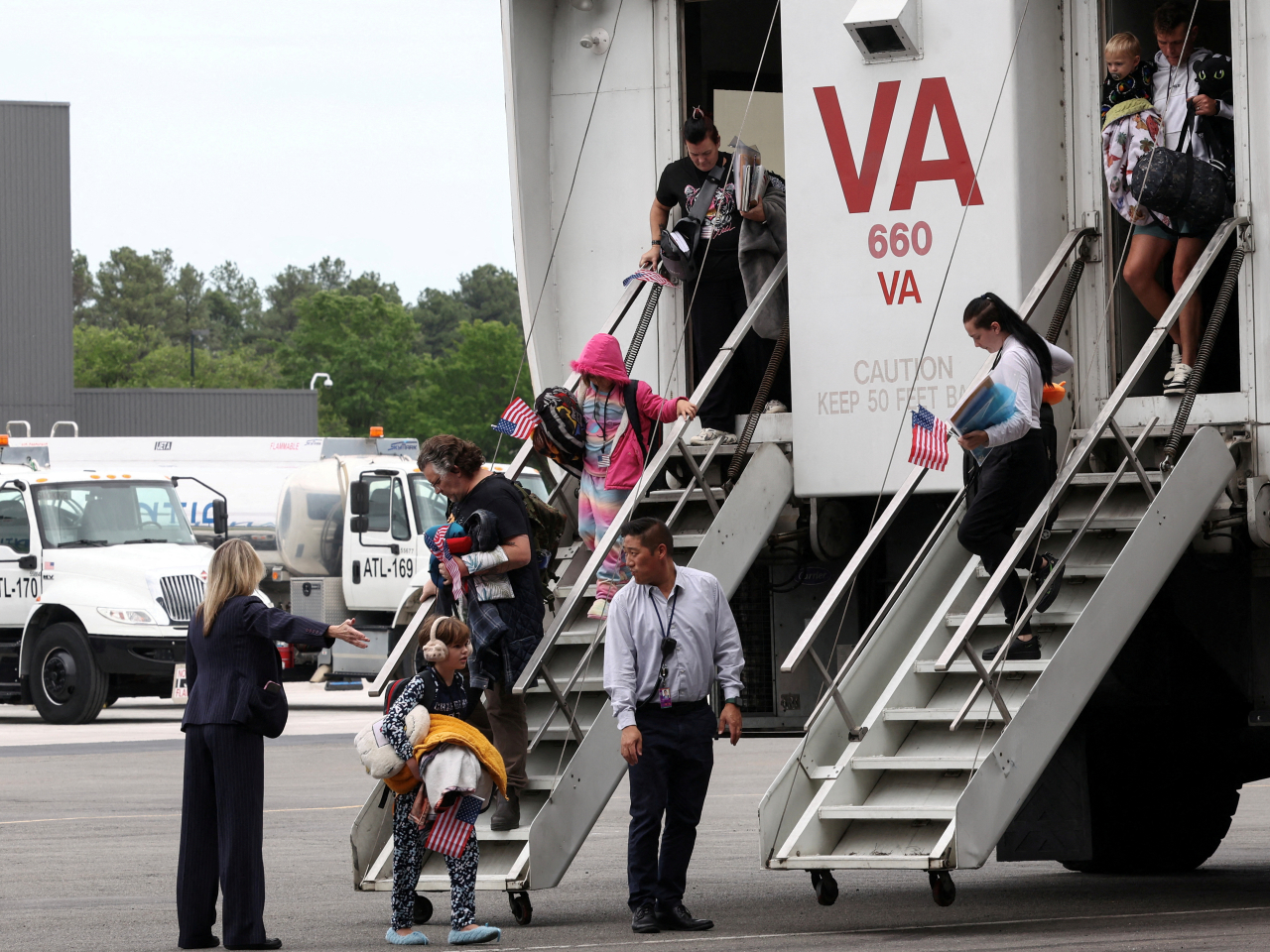 The first group of white South African 'refugees' step from a people-mover vehicle upon arrival at Dulles International Airport in May. File photo: Reuters