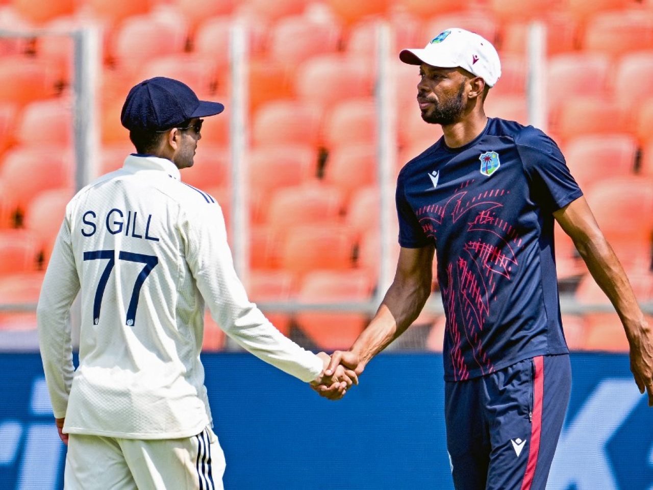 India's captain Shubman Gill shakes hands with his West Indies' counterpart Roston Chase after his team's victory in Ahmedabad. Photo: AFP