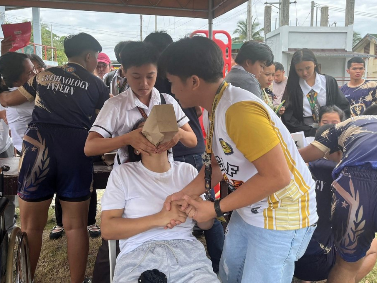 Some students in Davao de Oro, Mindanao, get assistance after the magnitude-7.4 earthquake struck off the southern Philippines. Photo: AFP