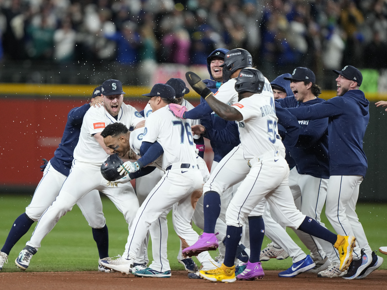 Jorge Polanco is mobbed by teammates after hitting the winning single in the fifteenth inning. Photo: Reuters