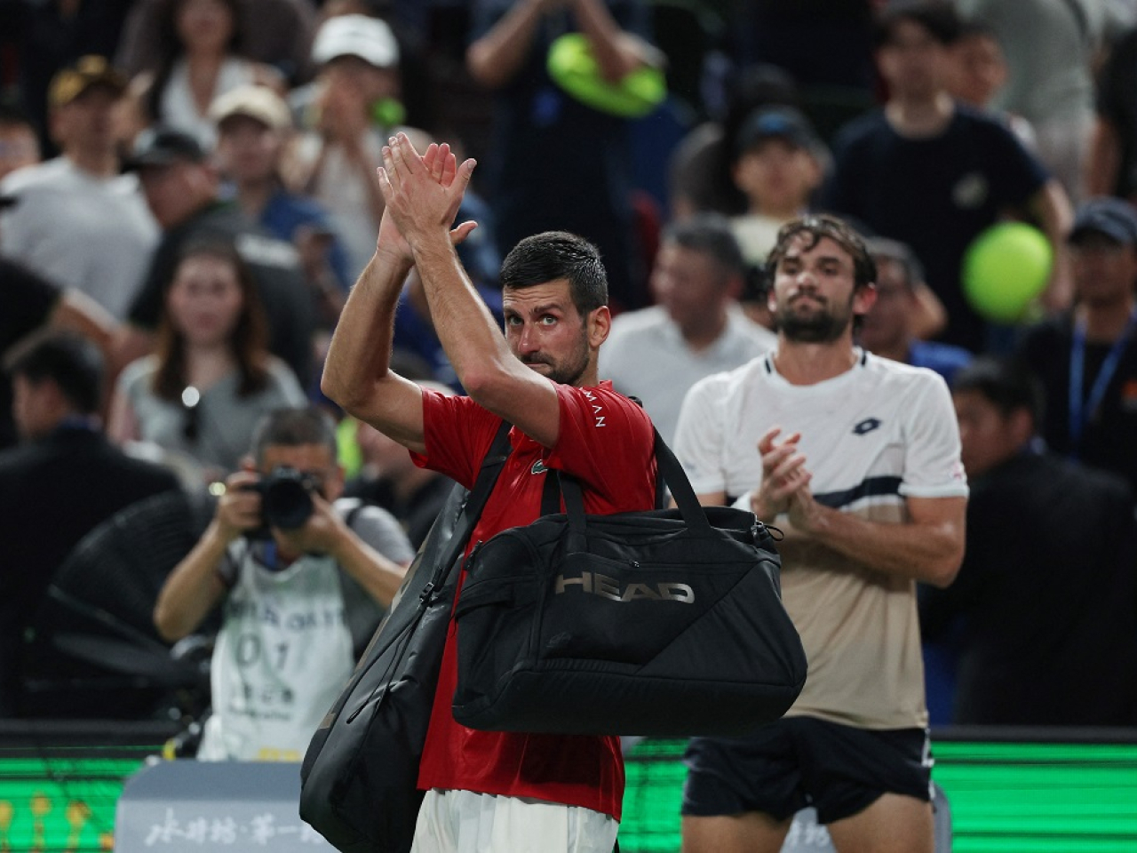 Serbia's Novak Djokovic walks off the court after losing his semi final match against Monaco's Valentin Vacherot. Photo: Reuters