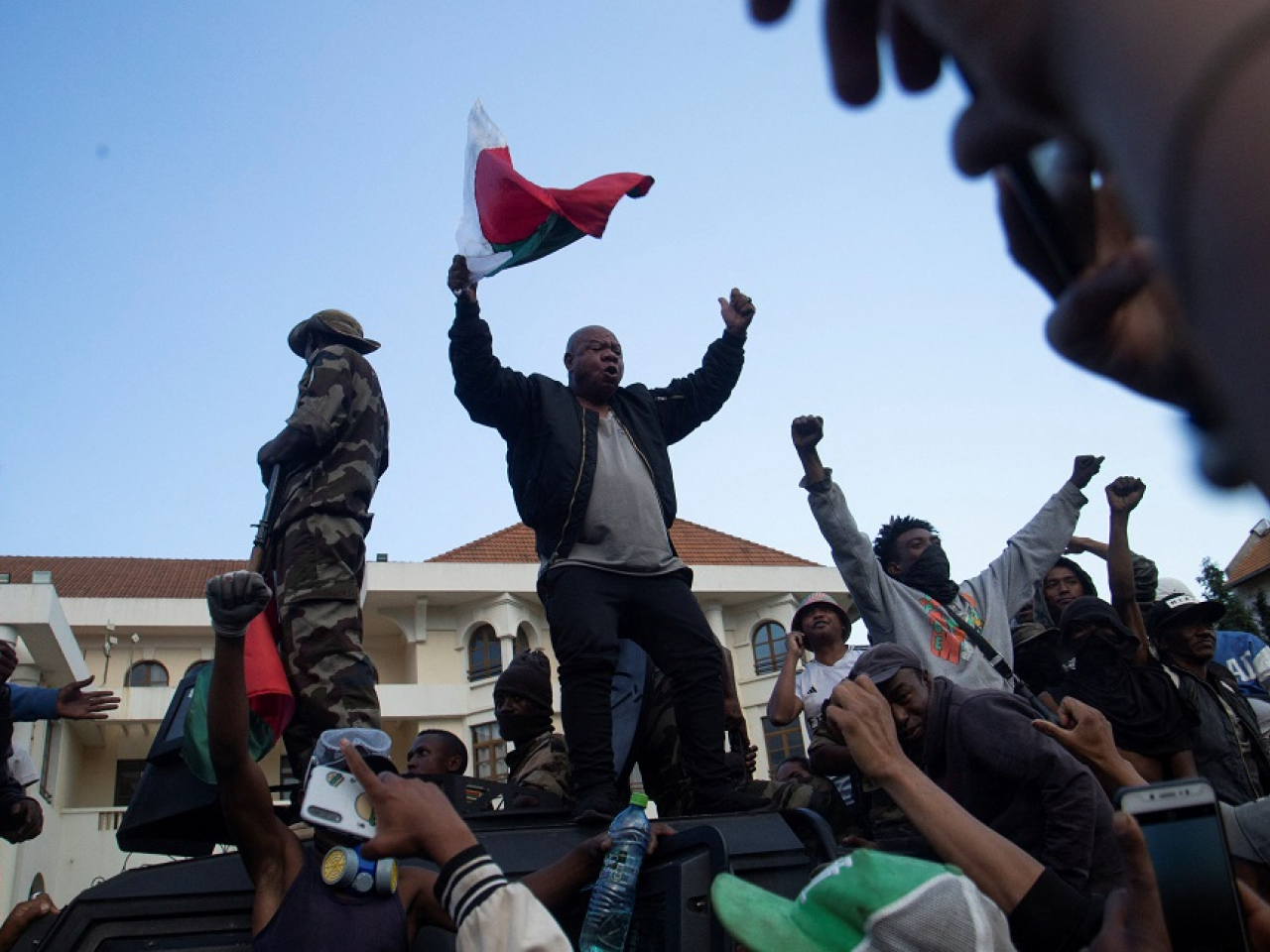 Demonstrators celebrate the news that the Capsat military unit is joining them. Photo: Reuters
