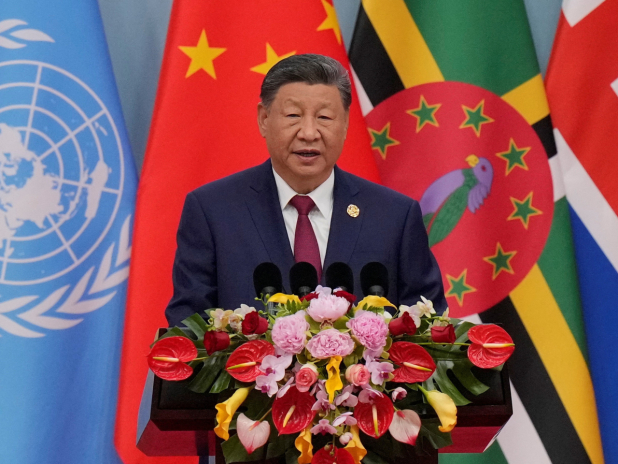 習近平在北京舉行的全球婦女峰會致辭。(路透社)