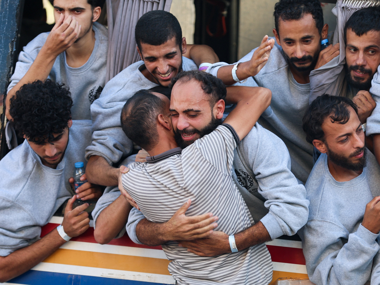 A man hugs a freed Palestinian prisoner released by Israel as part of a hostages-prisoners swap in Khan Younis in the southern Gaza Strip. Photo: Reuters