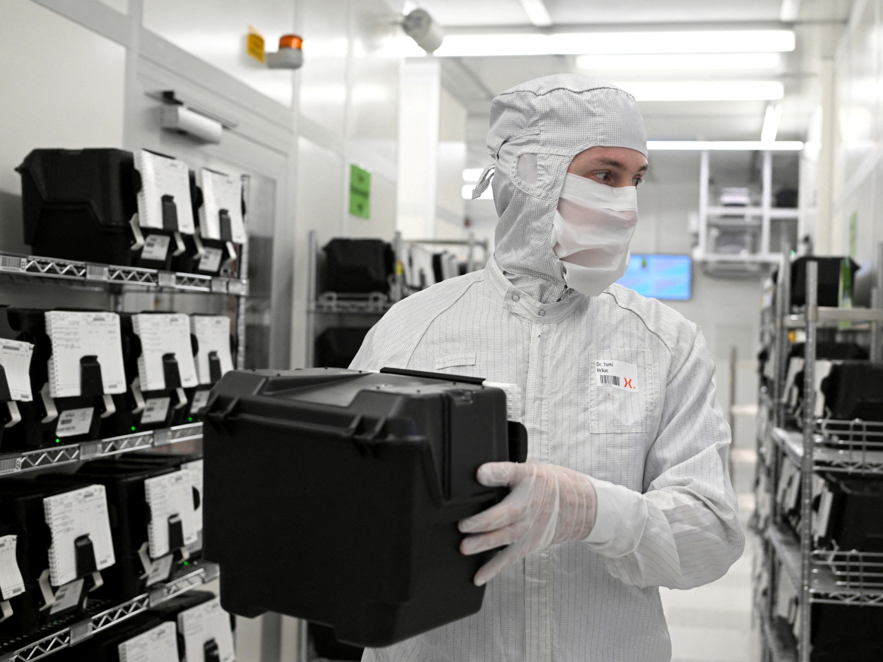 An employee holds a box of wafers in a production line of Nexperia. File photo: Reuters