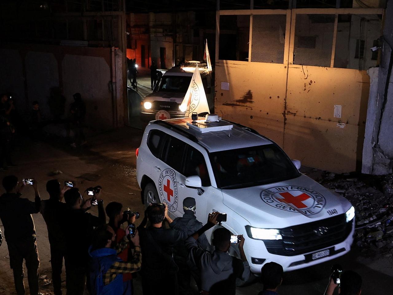 Red Cross vehicles transport the bodies of deceased hostages after they were handed over by Hamas militants as part of a ceasefire deal. Photo: Reuters
