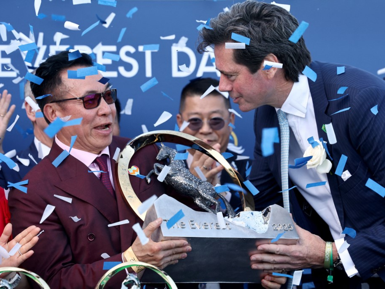 Ka Ying Rising owner Leung Shek-kong is handed the Everest trophy. Photo: AFP