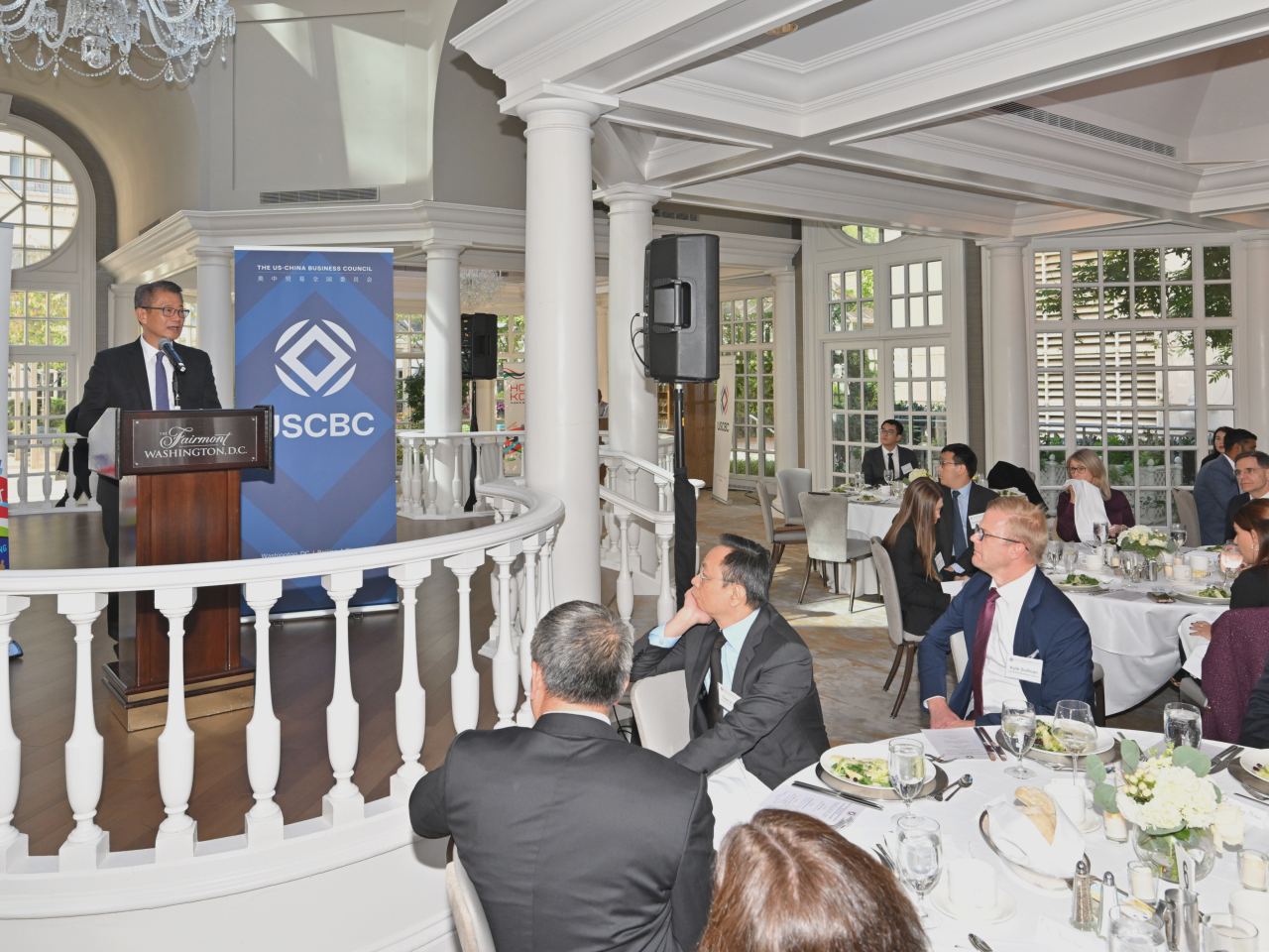 Paul Chan says in his address at the luncheon that Hong Kong remains open for American businesses and talent to invest and seek career development. Photo courtesy of the Information Services Department