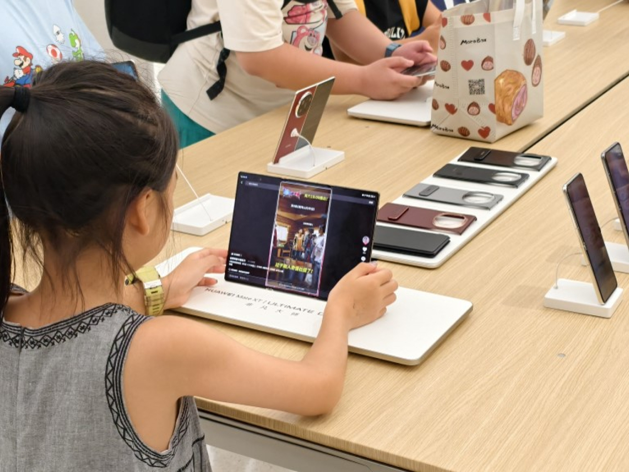 Parent-led group 'Look Up Hong Kong' says many kids get first smartphone when they are around nine. File photo: AFP