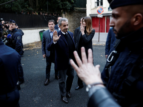 Nicolas Sarkozy leaves his house to begin his five-year prison sentence. Photo: Reuters