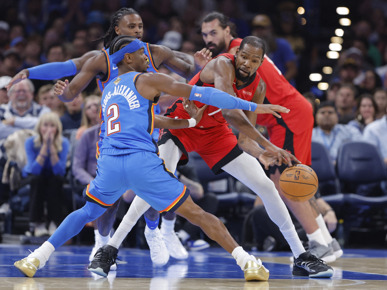 Reigning league MVP Shai Gilgeous-Alexander, left, led OKC to victory in their season opener. Photo: Reuters