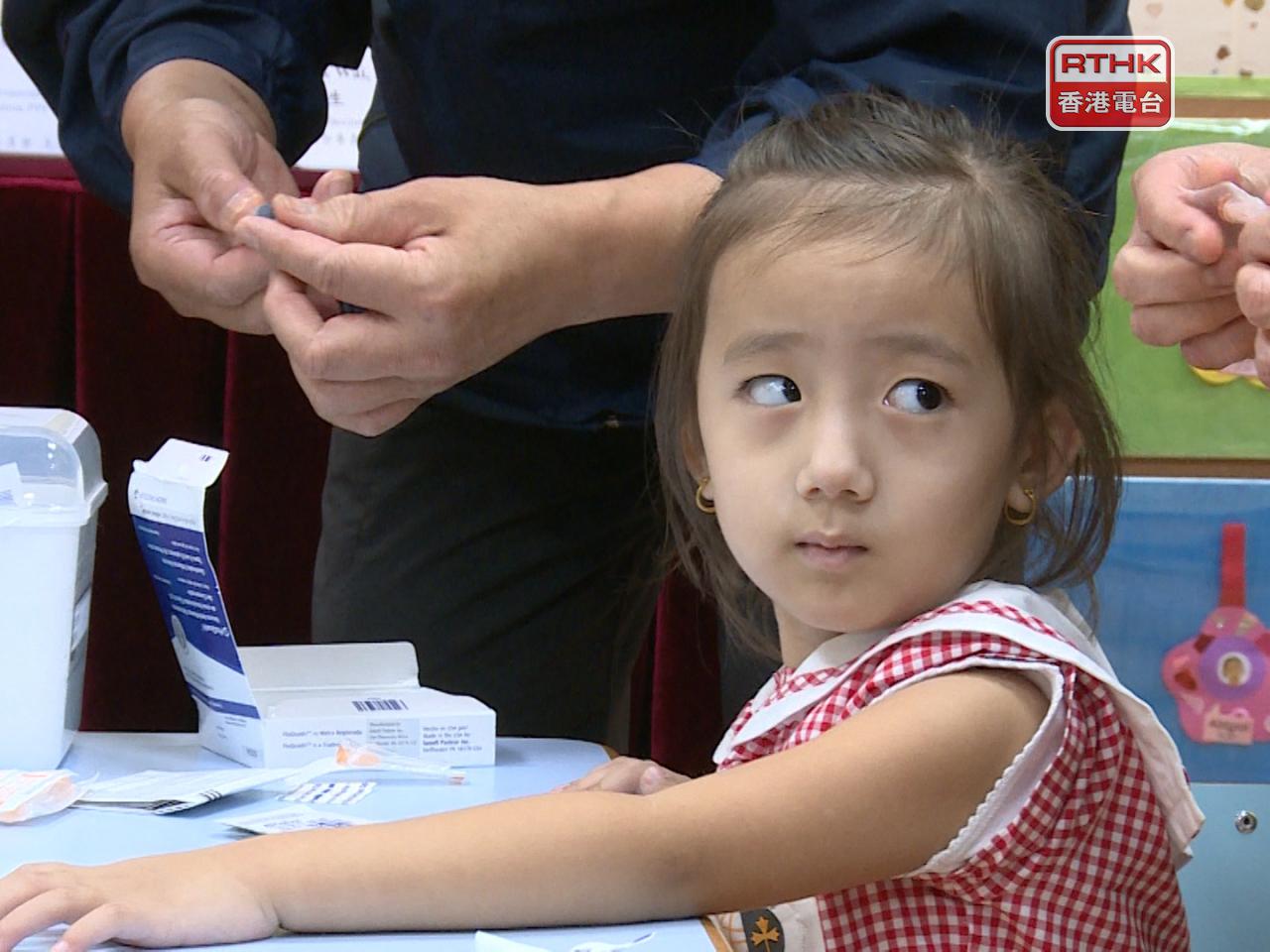 Lo Chung-mau calls on parents to get their kids vaccinated as soon as possible. File photo: RTHK