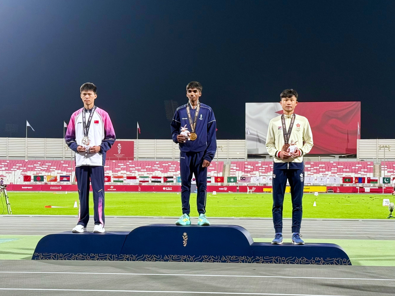 Adrian Au (right) earned the SAR's first medal at this year's Asian Youth Games. Photo courtesy: SF&OC of Hong Kong, China