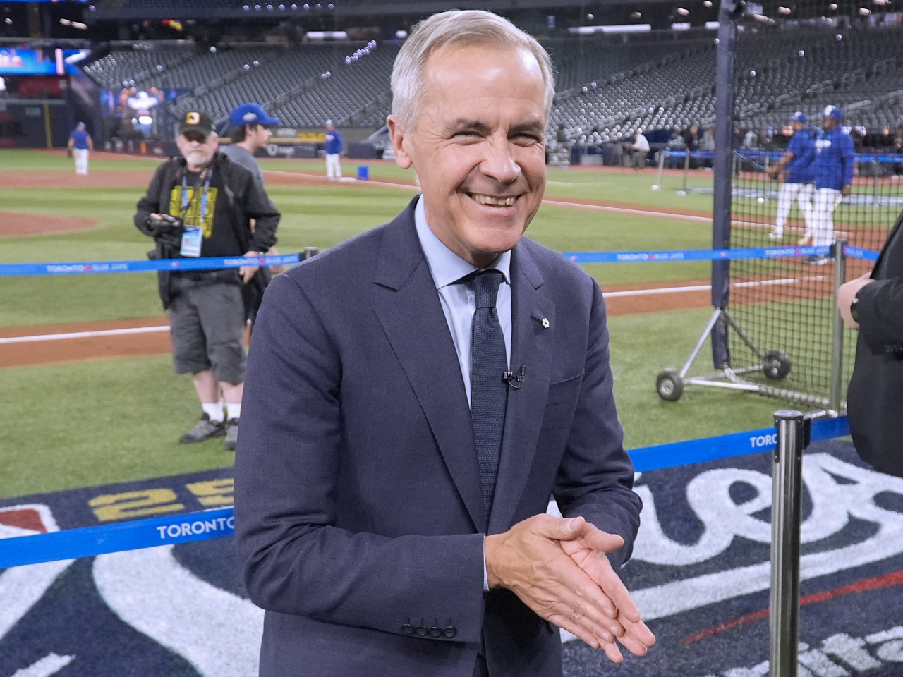 Mark Carney visits Rogers Centre in Toronto just before the Blue Jay's World Series opening baseball game with the Los Angeles Dodgers and flying to Asia. Photo: Reuters
