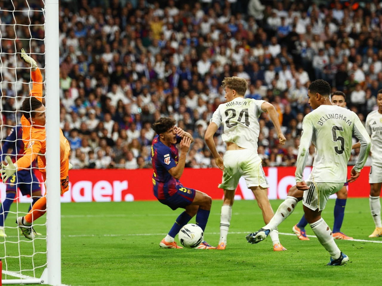 Jude Bellingham slots home the winner in El Clasico. Photo: Reuters