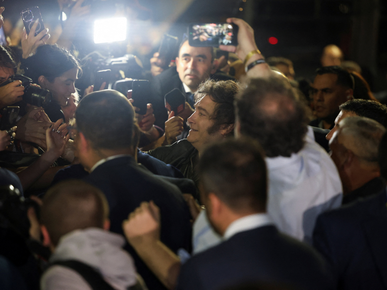 Argentina's President Javier Milei meets his supporters outside the campaign headquarters after the La Libertad Avanza party won the midterm election. Photo: Reuters
