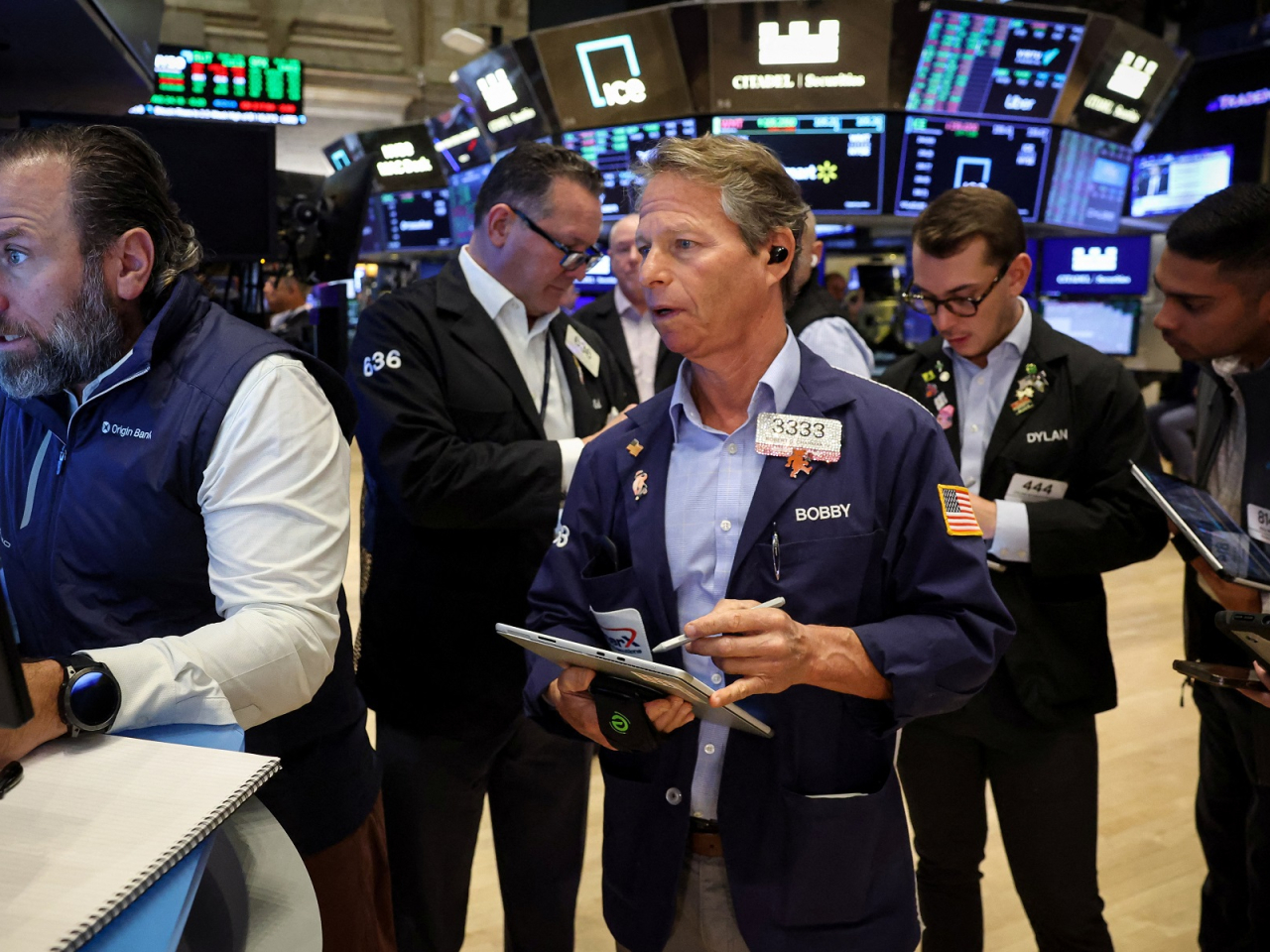 The Dow, S&P 500 and Nasdaq all finished at records on optimism about the prospects of a trade deal between China and the US. Photo: Reuters
