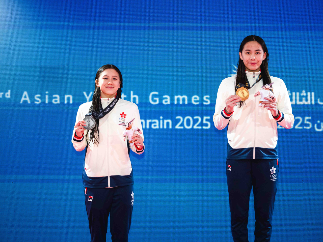 Eunis Man (left) and Claire Cheung struck gold and silver respectively in the 50m breaststroke. Photo courtesy of SF&OC of Hong Kong, China