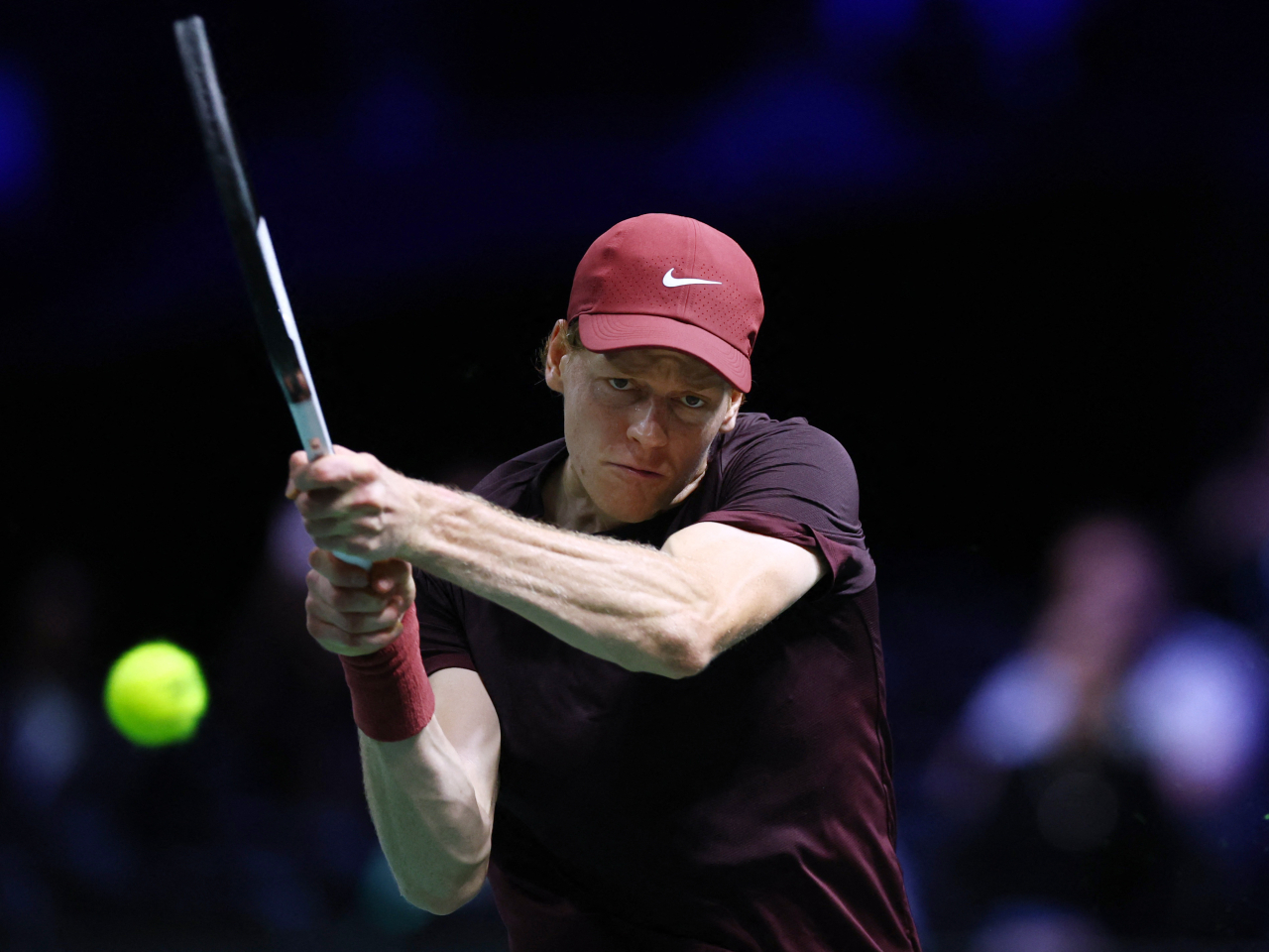 Jannik Sinner returns a backhand shot to Ben Shelton at the  Paris La Defense Arena, Nanterre. Photo: Reuters