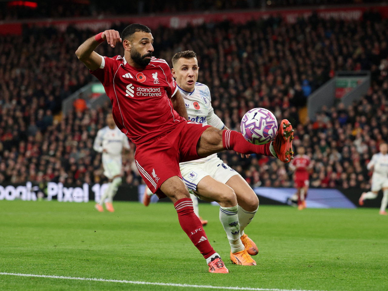 Liverpool's Mohamed Salah in action with Aston Villa's Lucas Digne. Photo: Reuters