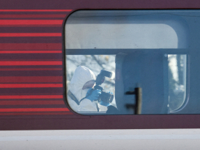 A forensic officer takes pictures of the London North Eastern Railway (LNER) train where a series of stabbings took place, at a platform at Huntingdon Station. Photo: Reuters