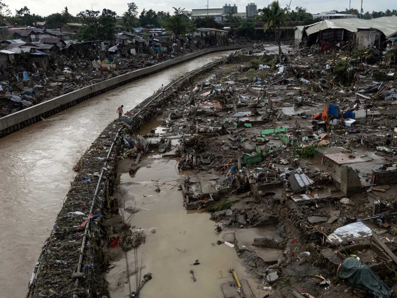 A drone view shows a man walking amid the damage caused by Typhoon Kalmaegi in Talisay, Cebu. Photo: Reuters