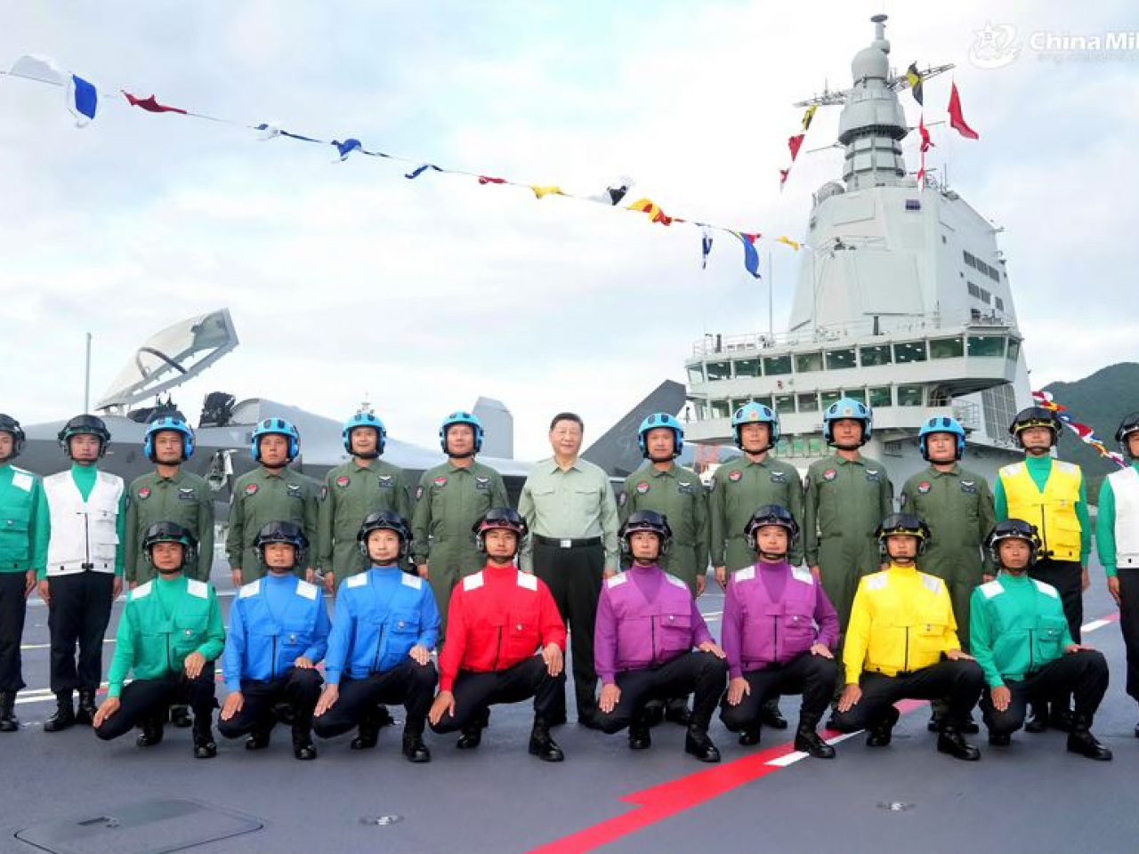 Xi Jinping with aircraft carrier personnel. Photo courtesy of Ministry of National Defense