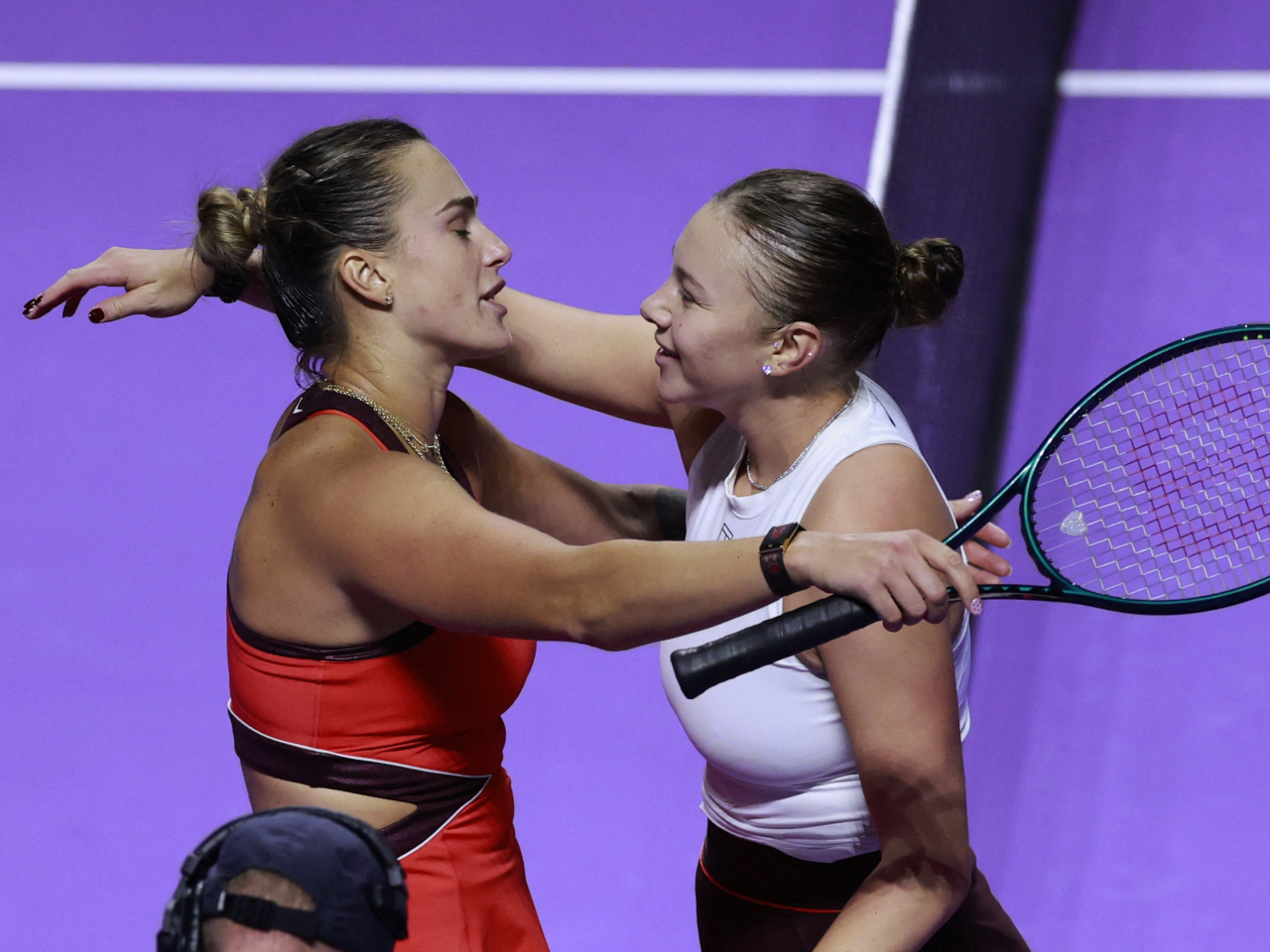 Aryna Sabalenka, left, hugs Amanda Anisimova after winning her way through to the WTA Finals championship match in Riyadh. Photo: Reuters