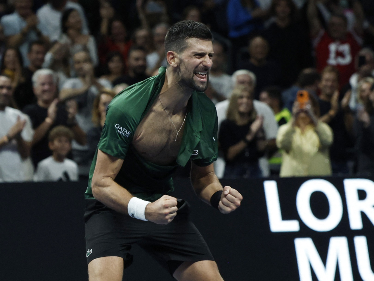 Serbia's Novak Djokovic celebrates after winning against Italy's Lorenzo Musetti in the Nitto ATP finals. Photos: Reuters.