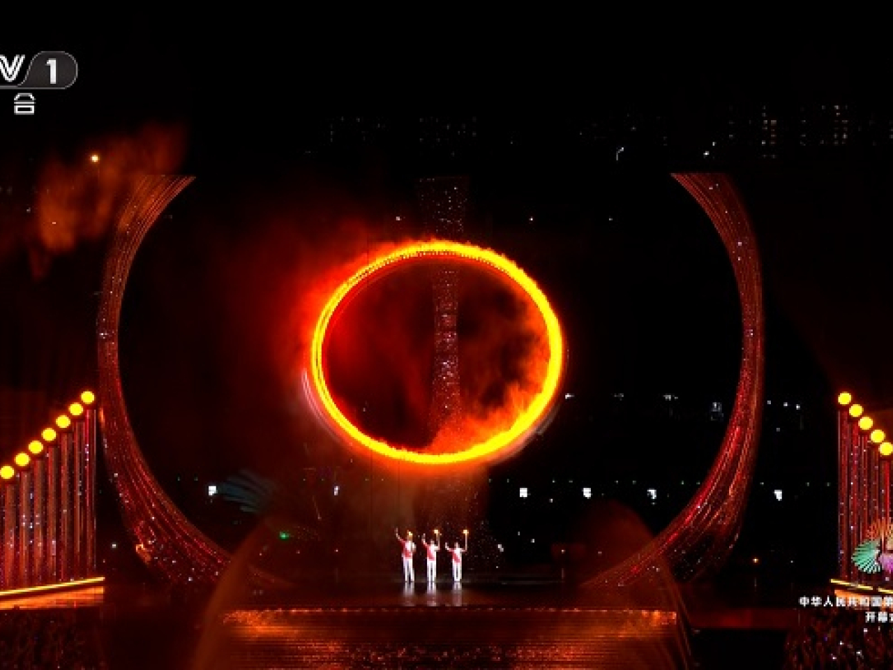 Edgar Cheung, Su Bingtian and Li Yi light the National Games cauldron.