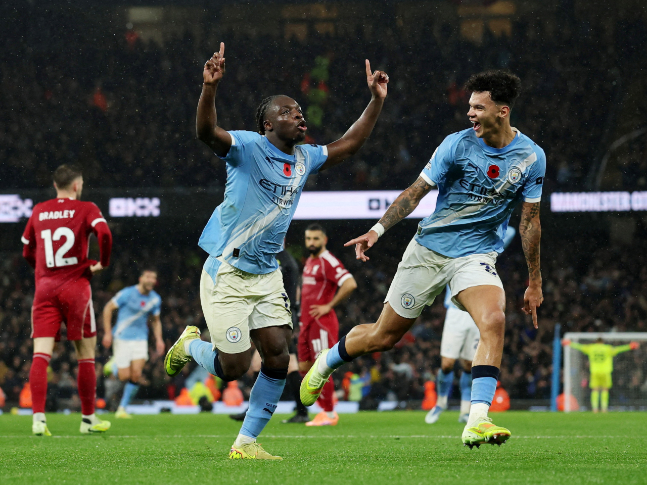 Jeremy Doku (left) rounded out the 3-0 win for Manchester City at the Etihad. Photo: Reuters
