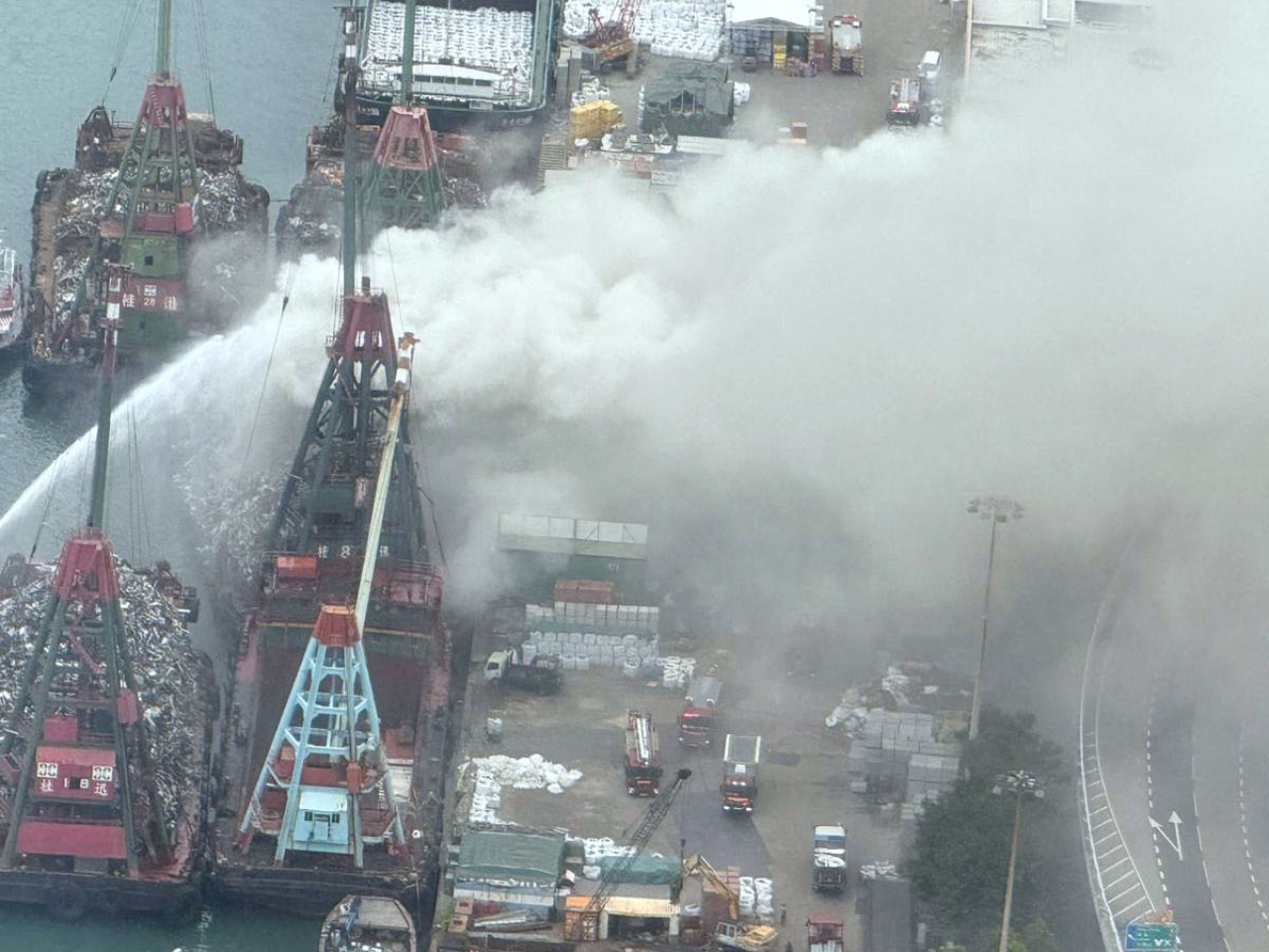 Firefighters were working to extinguish a fire at the New Yau Ma Tei Public Cargo Working Area. Photo: RTHK