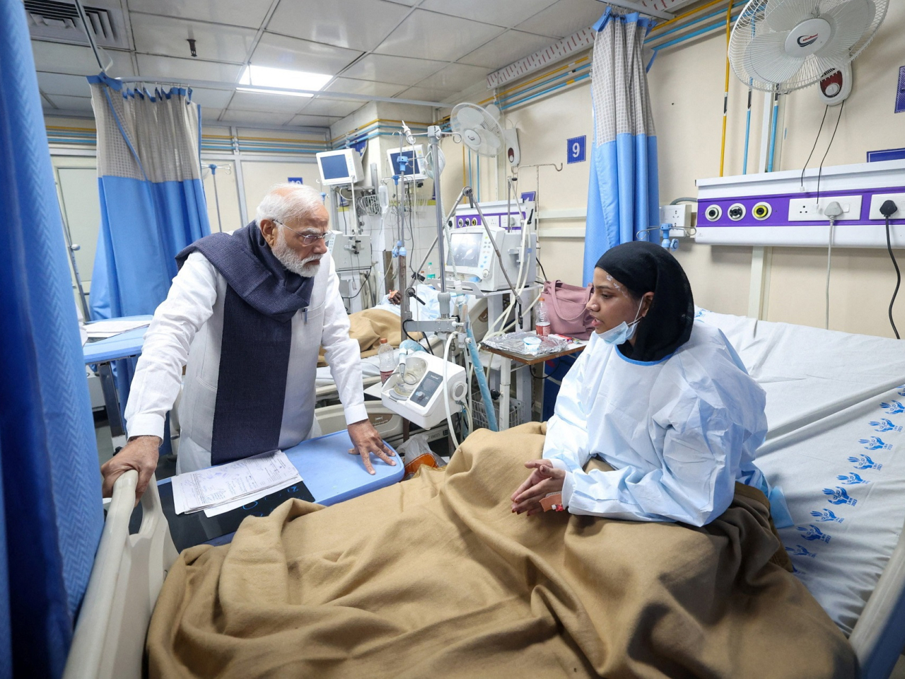 India's Prime Minister Narendra Modi speaks with a woman who was injured in the explosion near the historic Red Fort that officials are investigating as a "terror incident." Photo: Reuters