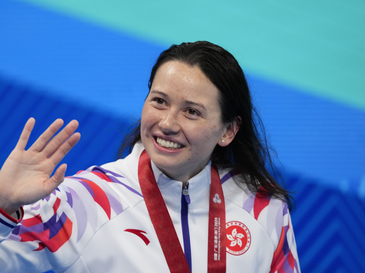 何詩蓓昨晚在女子200米自由泳，取得個人首面全運金牌。（新華社）