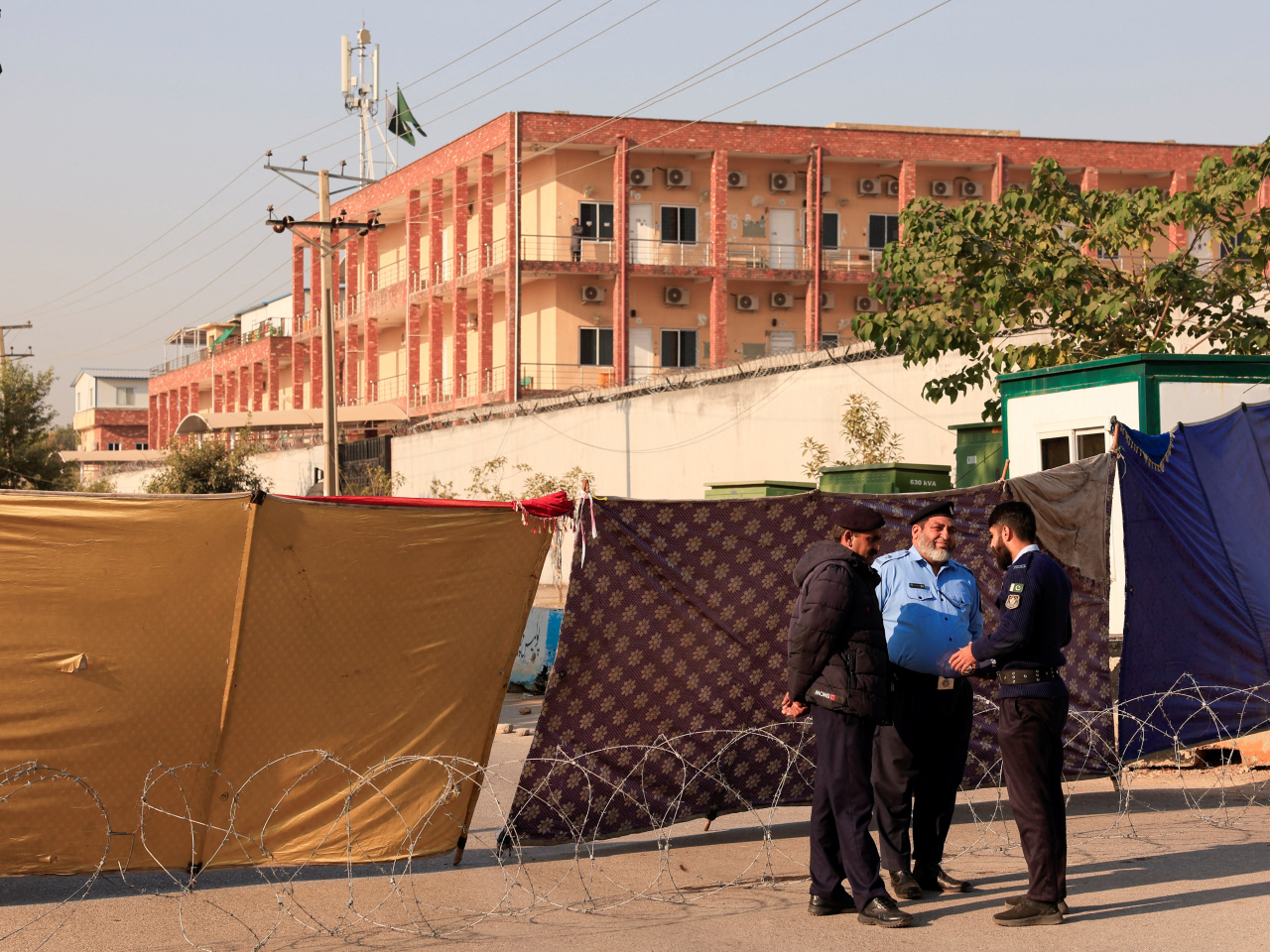 Police officers stand on a cordoned road, a day after a blast outside the district court building. Photo: Reuters