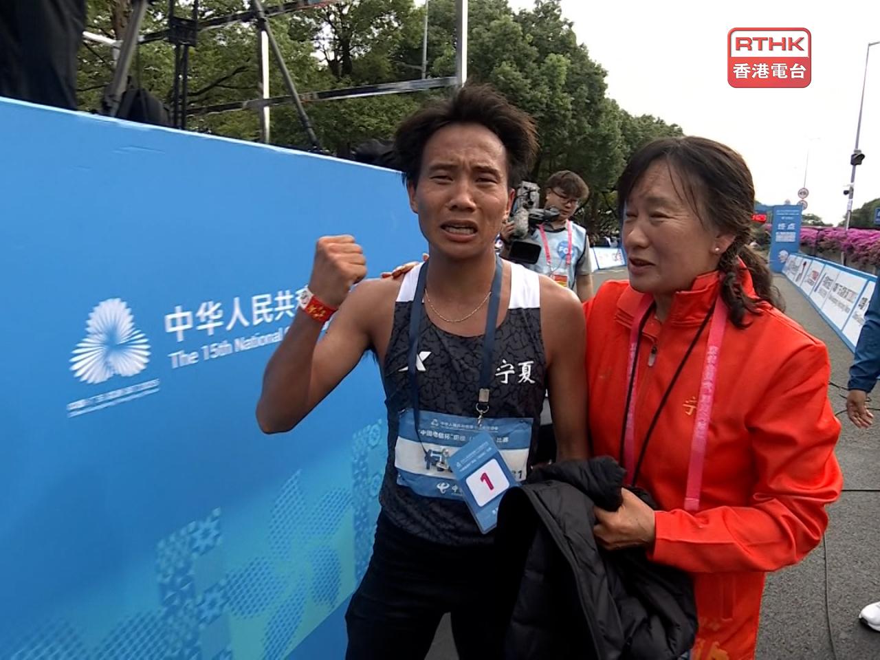 He Jie completed the 42 km race in two hours, 12 minutes and seven seconds.
