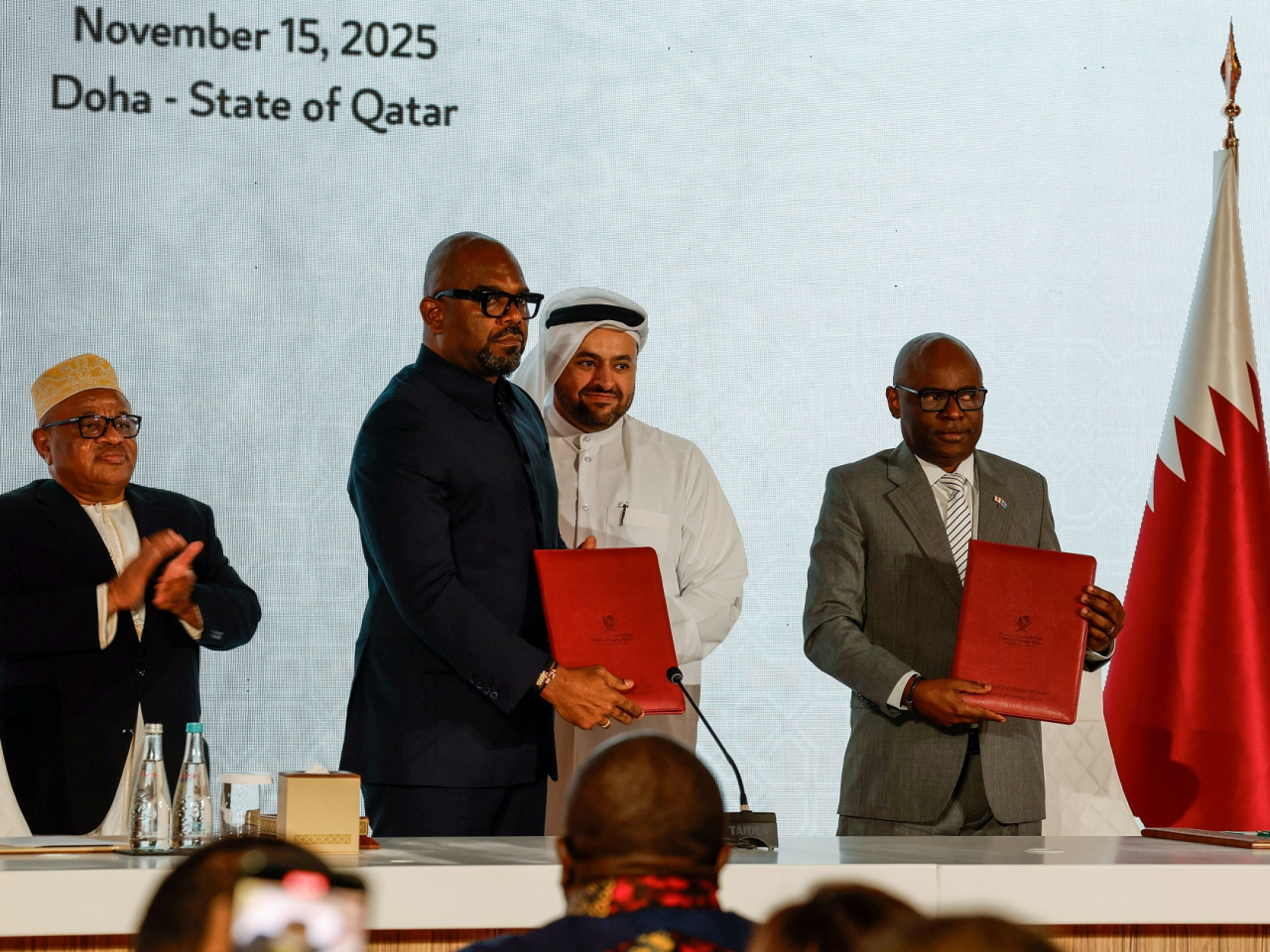 Representatives of the Democratic Republic of Congo and the M23 rebel group sign a framework agreement during a ceremony in Doha. Photo: Reuters