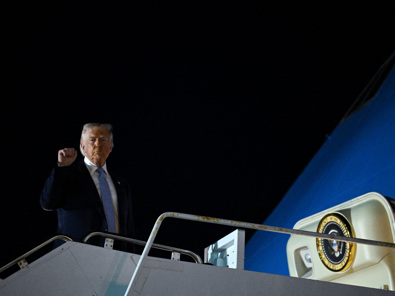 Donald Trump boards Air Force One for Washington after spending the weekend at his Mar-a-Lago golf club. Photo: Reuters