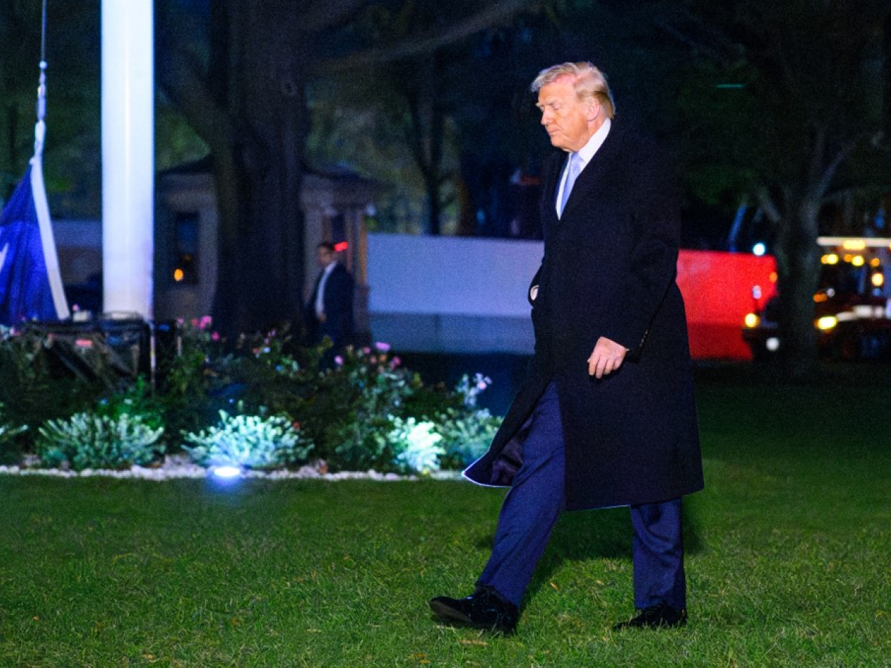 Donald Trump walks to the White House on the South Lawn upon his return to the capital. Photo: AFP