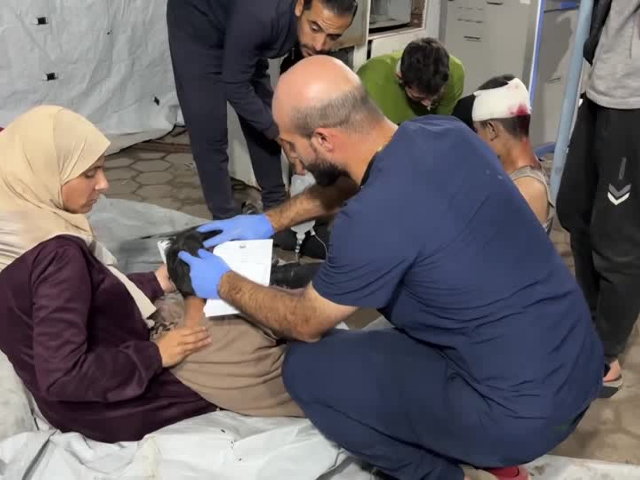 Medics treat injured children at the Al-Ahli Arab Baptist Hospital in Gaza City. Photo: Reuters