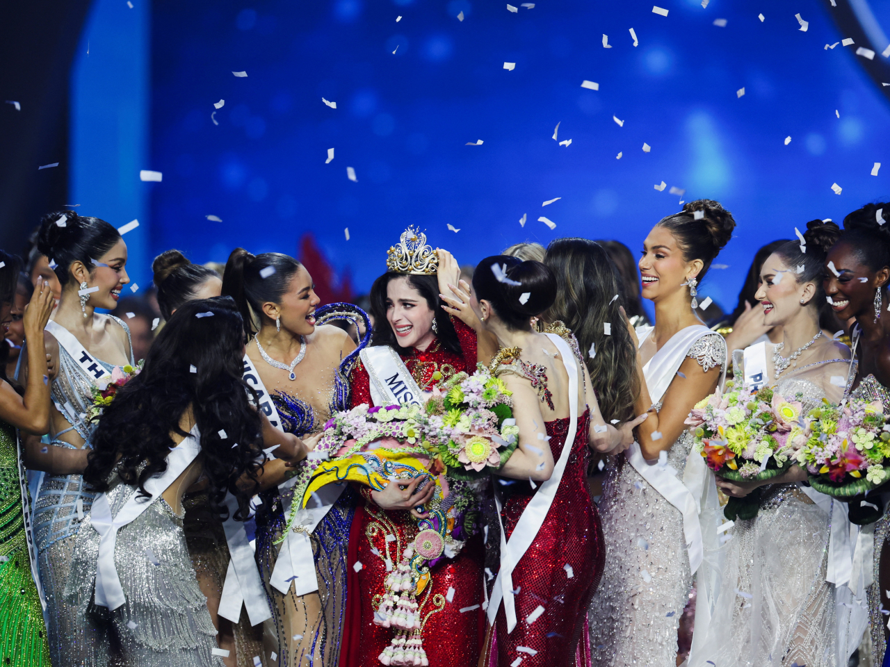 Fatima Bosch of Mexico is swamped by other contestants in celebrating her crowning as Miss Universe in Bangkok. Photo: Reuters
