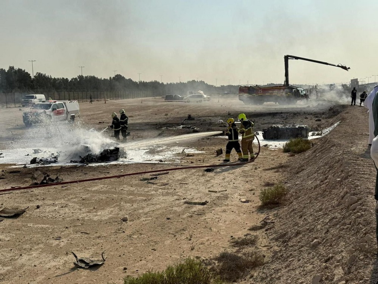 Firefighters work at the site of a crash involving an Indian-made HAL Tejas fighter jet at the Dubai Air Show, United Arab Emirates. Photo: Reuters