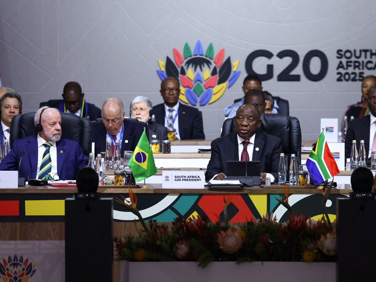 South Africa's President Cyril Ramaphosa speaks as his Brazilian counterpart, Luiz Inacio Lula da Silva, looks on on the first day of the G20 summit in Johannesburg. Photo: Reuters