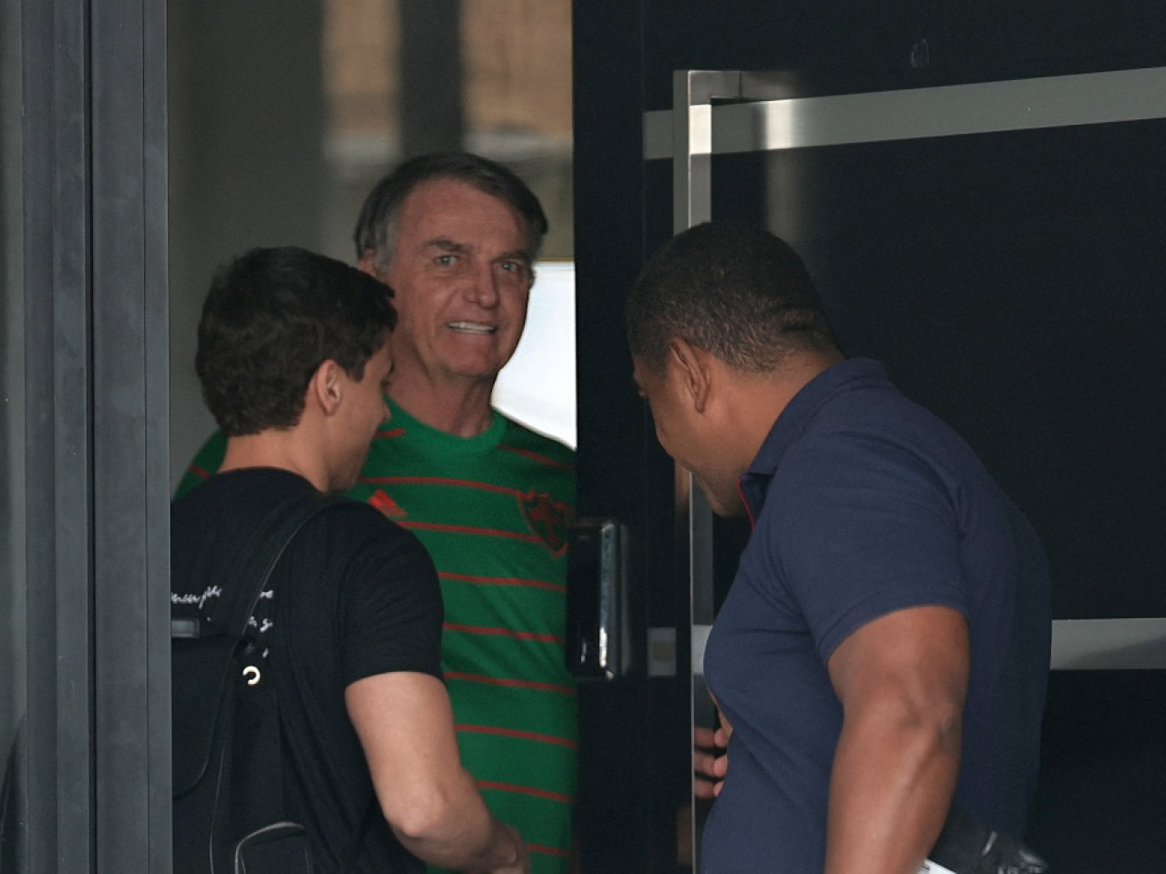 Brazil’s former President Jair Bolsonaro appears in the doorway of his house, during his house arrest, in Brasilia, Brazil. File photo: Reuters