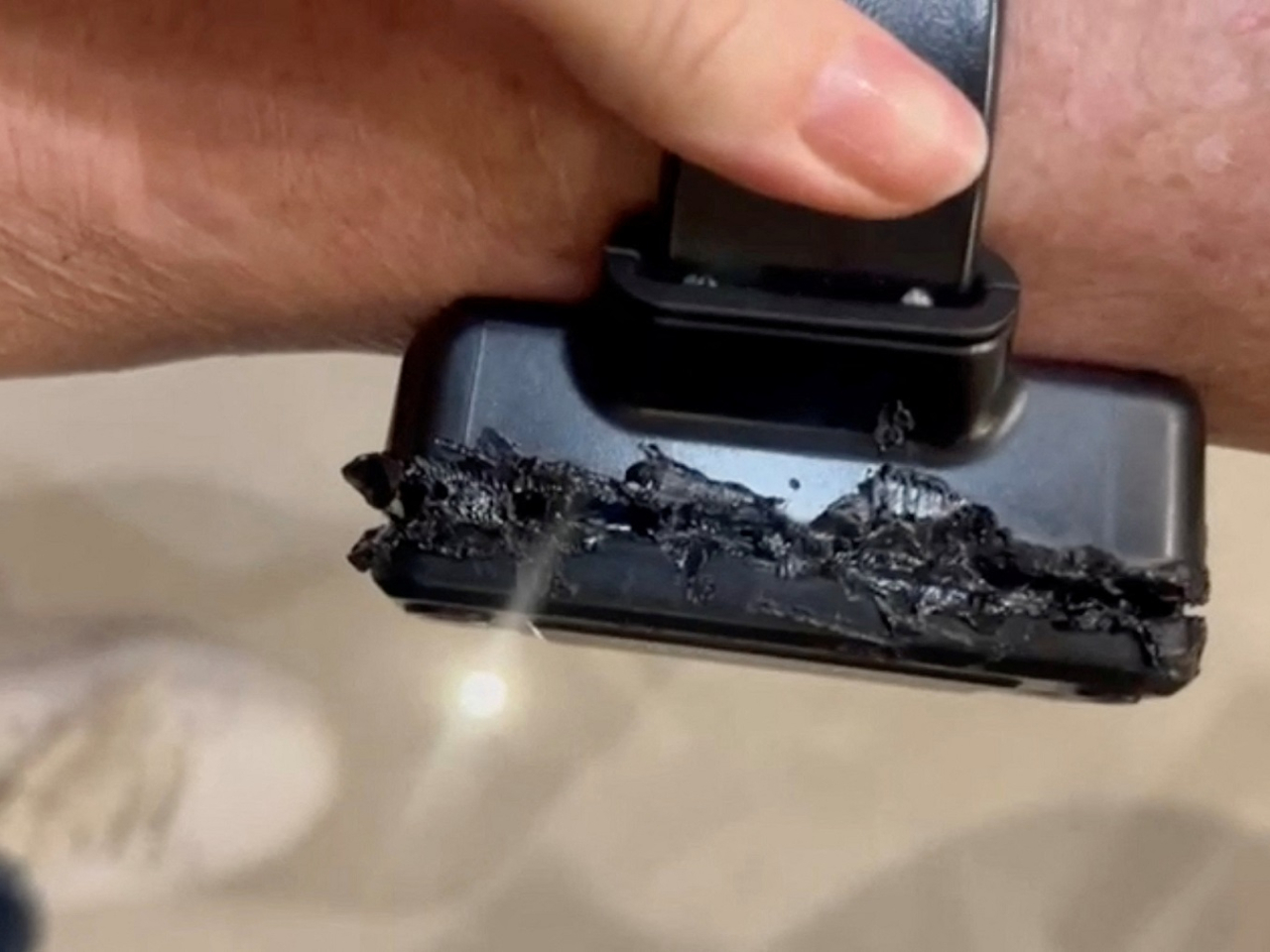 A still image taken from a video released by Brazilian authorities shows what they say is the damaged ankle monitor of former president Jair Bolsonaro after he tried to open it with a soldering iron. image: handout via Reuters